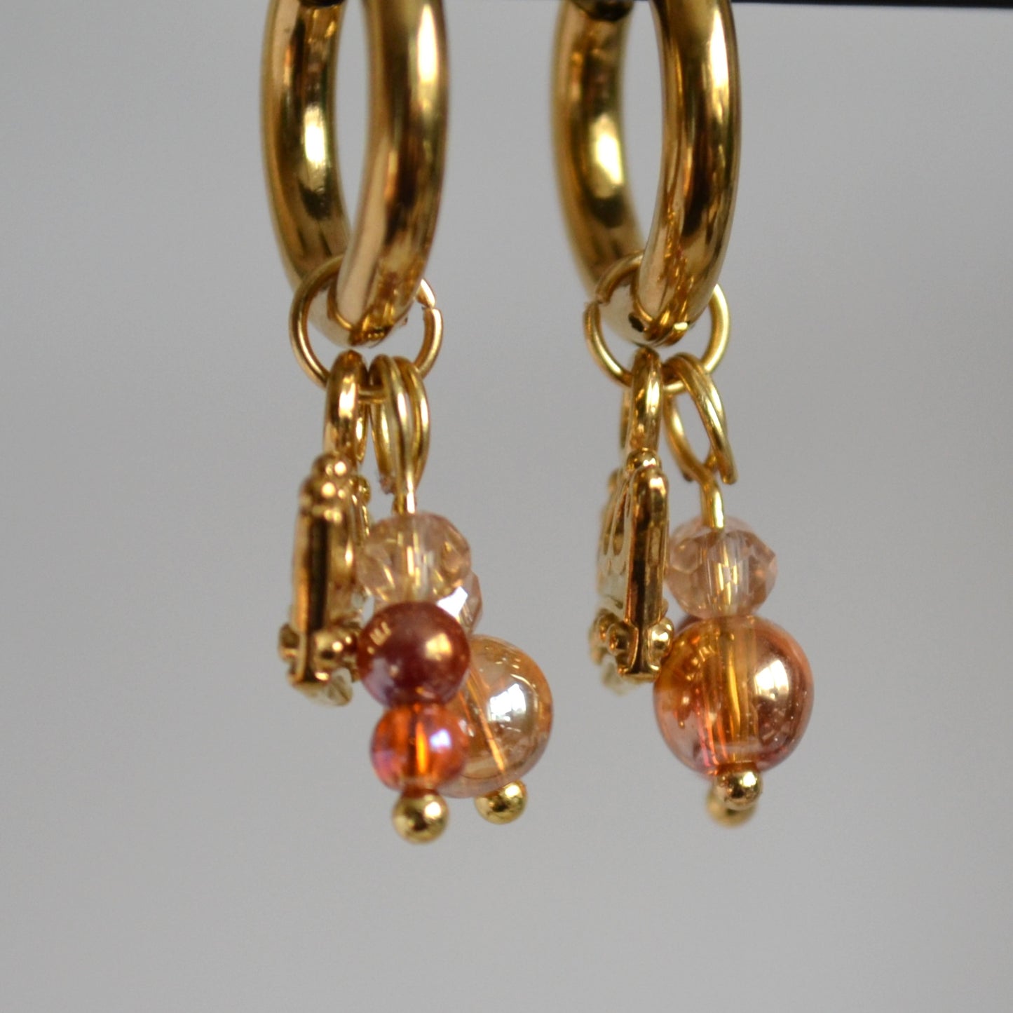 Oorbellen Crown goudkleurig met kristalglas en parel hanger